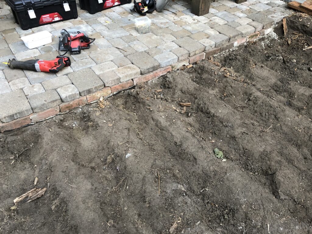 Bricks under Pavers - Brick Barrier - Digging out the dirt